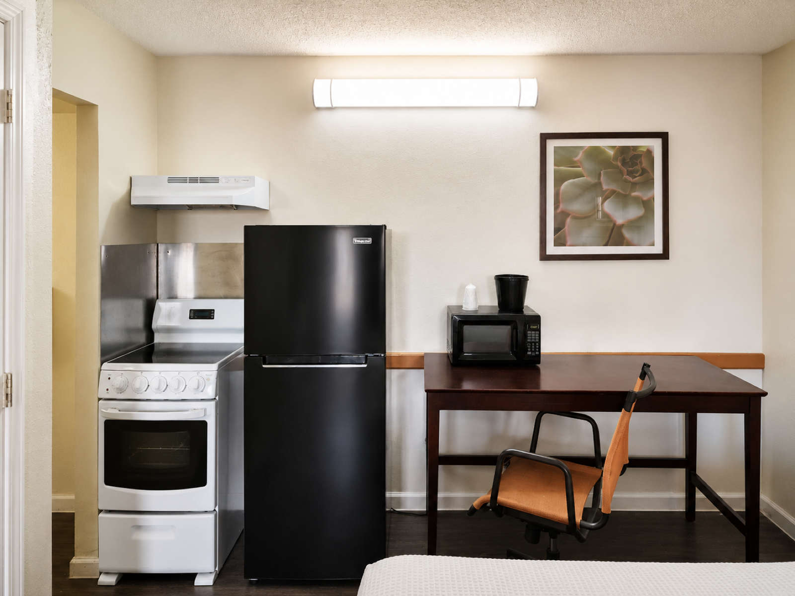 Studio Lodge of Columbus kitchenette and workspace