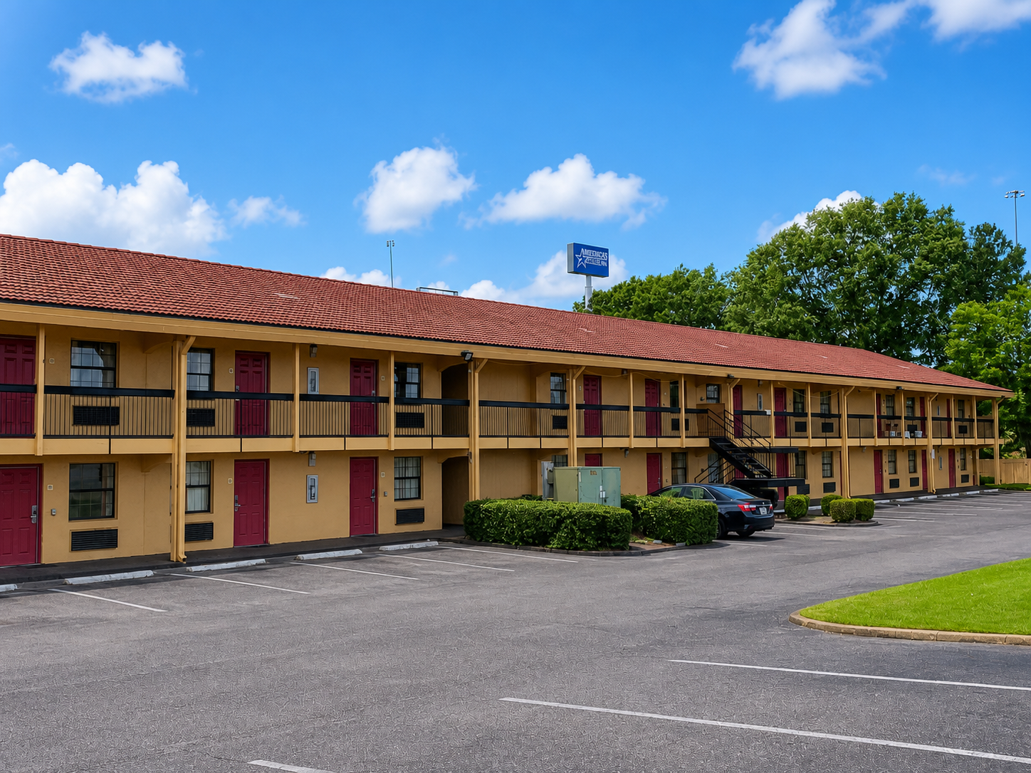 Studio Lodge Montgomery exterior with parking lot