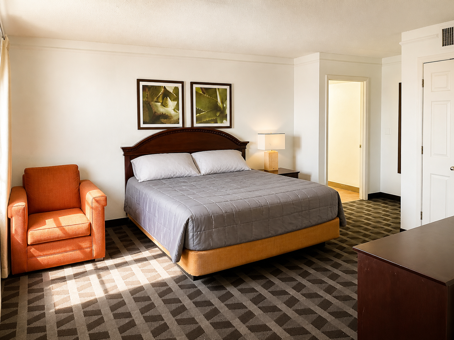 Montgomery suite with king bed and sitting chair