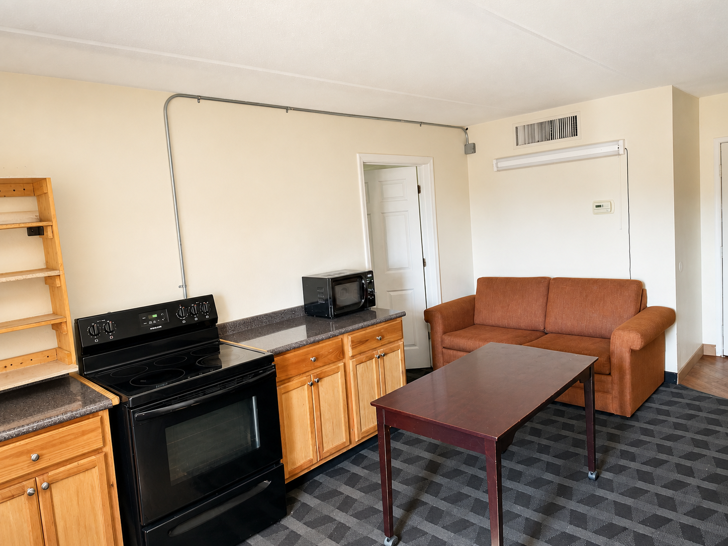 Montgomery suite kitchen and living area with sofa