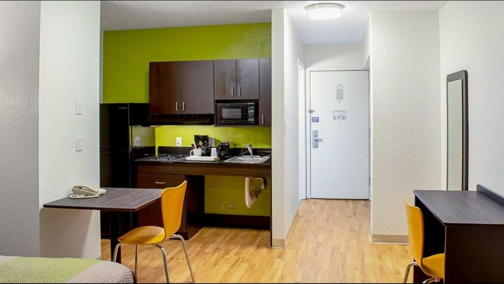 Springdale kitchenette with desk and guest room entry